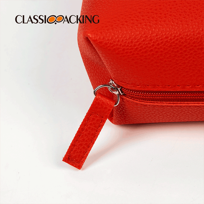 red-faux-leather-toiletry-bag-zipper-close-up